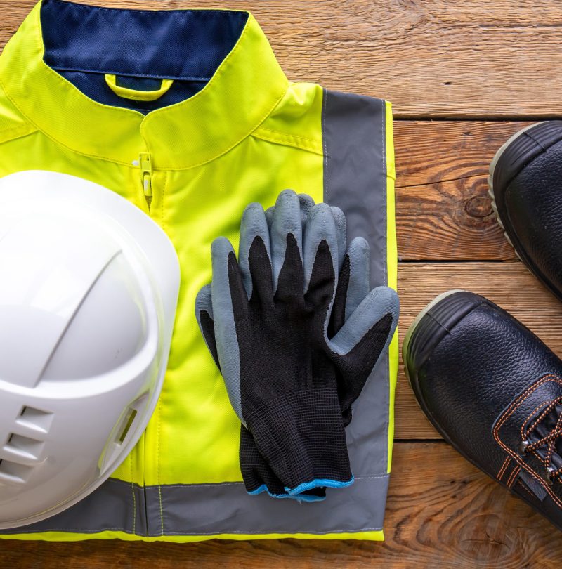 Flat lay, tablet and builder uniform items, builder work and repair concept.